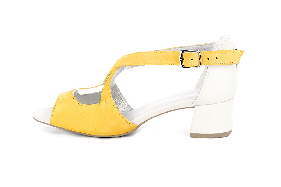 Women's yellow and off white elegant sandals closed at the back with crossed straps. Round toe. Low flare heels - Profile view